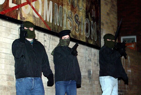 Volunteers from the Continuity Irish Republican Army,(CIRA) who are currently not on ceasefire hold a show of strength early Saturday in the mainly Catholic Beechmount area of west Belfast, Northern Ireland . The terror group issued a warning Sunday July 11, 2004, that if Catholics are attacked by Protestant terrorist groups then their armed reaction would be calculated and immediate Volunteers from the Continuity Irish Republican Army,(CIRA) who are currently not on ceasefire hold a show of strength early Saturday in the mainly Catholic Beechmount area of west Belfast, Northern Ireland . The terror group issued a warning Sunday July 11, 2004, that if Catholics are attacked by Protestant terrorist groups then their armed reaction would be calculated and immediate - Sputnik International