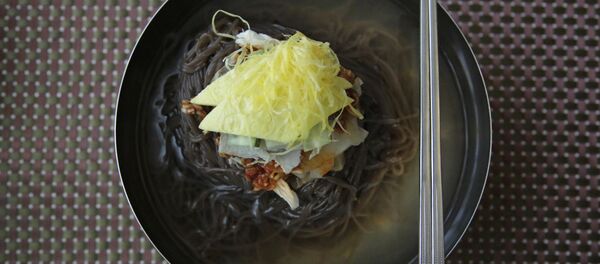 In this Friday, June 16, 2017, photo, a bowl of Naengmyeon or cold buckwheat noodles, popular among North Koreans, is served in a restaurant in Pyongyang, North Korea In this Friday, June 16, 2017, photo, a bowl of Naengmyeon or cold buckwheat noodles, popular among North Koreans, is served in a restaurant in Pyongyang, North Korea - Sputnik International