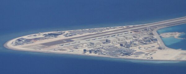 Chinese structures and an airstrip on the man-made Subi Reef at the Spratly group of islands in the South China Sea are seen from a Philippine Air Force C-130 transport plane of the Philippine Air Force, Friday, April 21, 2017 - Sputnik International