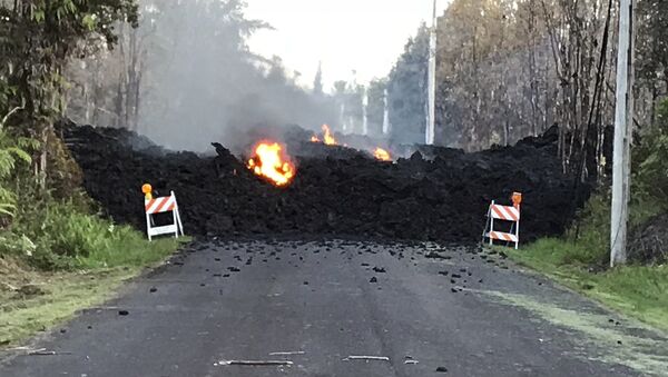 This photo provided by Hawaii Electric Light shows Mohala Street in Leiliani Estates near the town of Pahoa on Hawaii's Big Island that is blocked by a lava flow from the eruption of Kilauea volcano. - Sputnik International