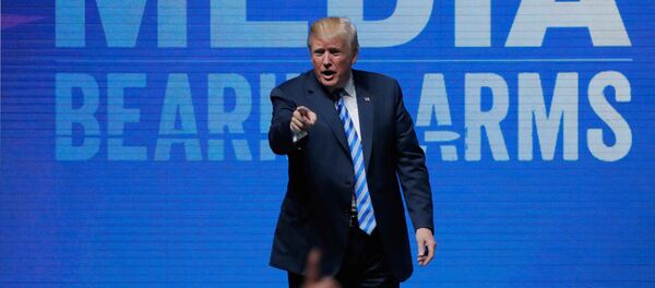 U.S. President Donald Trump gestures after speaking at a National Rifle Association (NRA) convention in Dallas, Texas, U.S. May 4, 2018 - Sputnik International