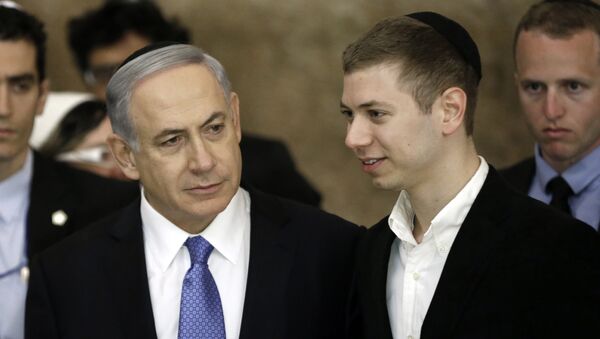 Israeli Prime Minister Benjamin Netanyahu (L) and his son Yair visit, on March 18, 2015, the Wailing Wall in Jerusalem following his party Likud's victory in Israel's general election - Sputnik International
