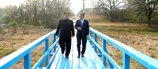 South Korean President Moon Jae-in and North Korean leader Kim Jong Un walk together at the truce village of Panmunjom inside the demilitarized zone separating the two Koreas, South Korea, April 27, 2018 South Korean President Moon Jae-in and North Korean leader Kim Jong Un walk together at the truce village of Panmunjom inside the demilitarized zone separating the two Koreas, South Korea, April 27, 2018 - Sputnik International