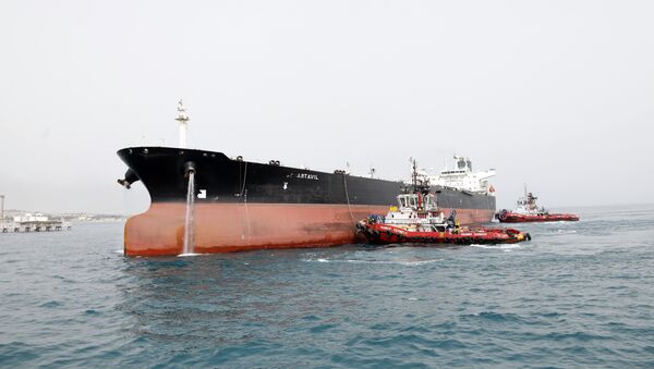 A picture taken on March 12, 2017, shows an Iranian tanker docking at the platform of the oil facility in the Khark Island, on the shore of the Gulf - Sputnik International