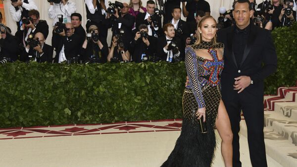 Jennifer Lopez, left, and Alex Rodriguez attend The Metropolitan Museum of Art's Costume Institute benefit gala celebrating the opening of the Heavenly Bodies: Fashion and the Catholic Imagination exhibition on Monday, May 7, 2018, in New York.  - Sputnik International