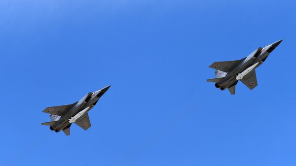 Multi-purpose fighters MiG-31 with the hypersonic Kinzhal rockets on the military parade devoted to the 73rd anniversary of the victory in the Great Patriotic War of 1941-1945 - Sputnik International