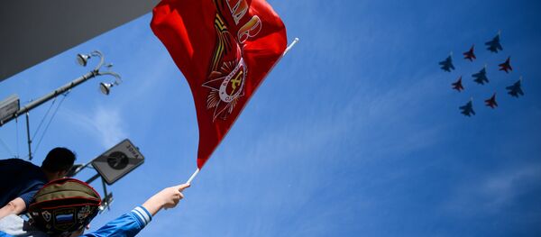 The multi-purpose SU-30SM fighters of the flight group Russian Knights and MiG-29 of the flight  Swifts group during an air part of the military parade devoted to the 73rd anniversary of the victory in the Great Patriotic War of 1941-1945 - Sputnik International