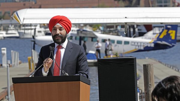 Navdeep Bains, Canada's Minister of Innovation, Science and Economic Development, speaks Wednesday, April 25, 2018, on Lake Union in Seattle at a news conference announcing that a partnership between Harbour Air and Kenmore Air will start offering direct one-hour seaplane flights between downtown Seattle and Vancouver, British Columbia, beginning Thursday - Sputnik International