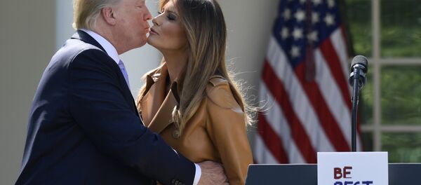 President Donald Trump kisses first lady Melania Trump following an event where Melania Trump announced her initiatives in the Rose Garden of the White House in Washington, Monday, May 7, 2018 President Donald Trump kisses first lady Melania Trump following an event where Melania Trump announced her initiatives in the Rose Garden of the White House in Washington, Monday, May 7, 2018 - Sputnik International