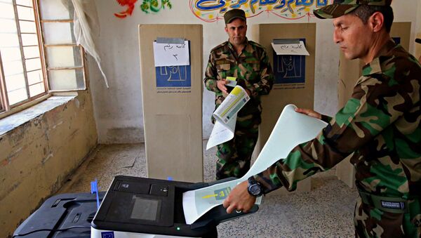 Iraqi soldiers prepare to cast their votes in early voting for Iraq's security forces, prisoners and hospital patients ahead of Saturday's national parliamentary elections, in Baghdad, Iraq, Thursday, May 10, 2018. - Sputnik International