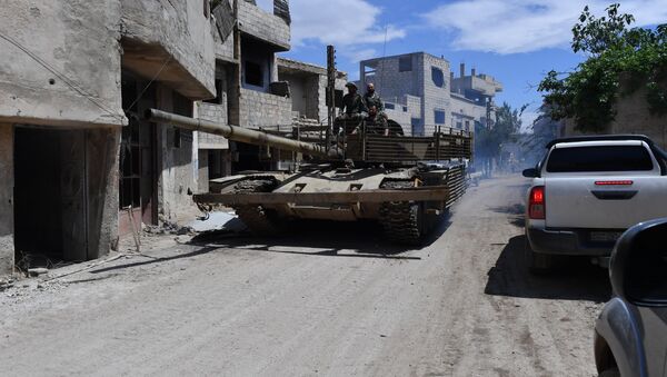 A T-55 tank in the area of the former Palestinian refugee camp Yarmouk in the southern suburb of Damascus - Sputnik International
