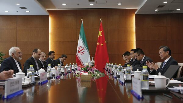 Chinese Foreign Minister Wang Yi, right, and Iranian Foreign Minister Mohammad Javad Zarif, left, attend a bilateral meeting Tuesday, Sept. 15, 2015 in Beijing, China - Sputnik International