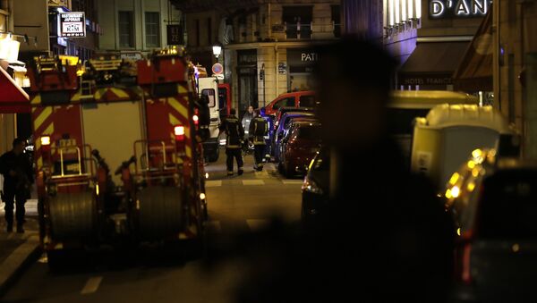 Policemen stand guard in Paris centre past firefighters vehicles after one person was killed and several injured by a man armed with a knife, who was shot dead by police in Paris on May 12, 2018 - Sputnik International