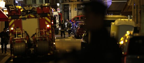 Policemen stand guard in Paris centre past firefighters vehicles after one person was killed and several injured by a man armed with a knife, who was shot dead by police in Paris on May 12, 2018 - Sputnik International