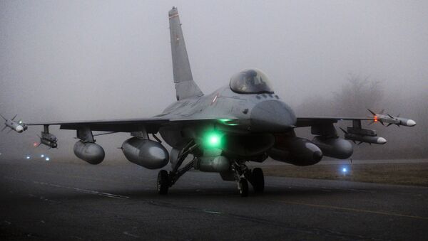 An F16 aircraft fighter is ready to take off from the Danish military base Fighter Wing Skrydstryp in Jutland early March 19, 2011 - Sputnik International