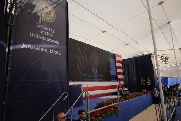 U.S. President Donald Trump is seen on screen as he delivers his speech during the opening ceremony of the new U.S. embassy in Jerusalem, Monday, May 14, 2018 - Sputnik International