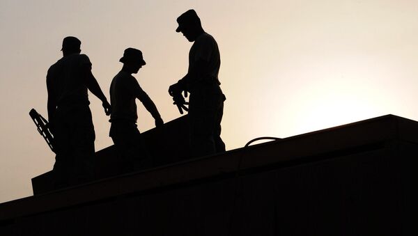 workers on a construction site - Sputnik International