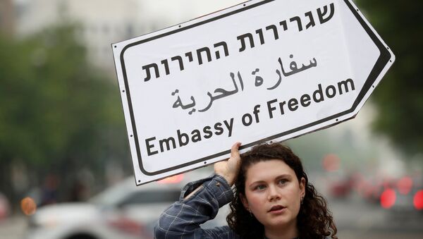 Hannah Boroff takes part in a protest outside of Trump International Hotel against the new U.S. Embassy opening in Jerusalem in Washington, U.S., May 14, 2018 - Sputnik International