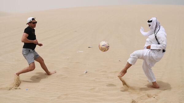 Playing football in the desert of Khor Al Adaid, Doha, State of Qatar. - Sputnik International