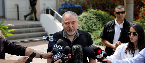 Israeli Defence Minister Avigdor Lieberman speaks after attending a meeting at an Israeli military base near Kissufim on the Israeli side of the border between Israel and the Gaza Strip, May 16, 2018 - Sputnik International
