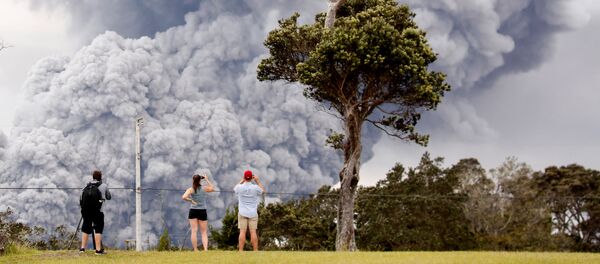 People watch as ash erupts from the Halemaumau crater near the community of Volcano during ongoing eruptions of the Kilauea Volcano in Hawaii, US, May 15, 2018 People watch as ash erupts from the Halemaumau crater near the community of Volcano during ongoing eruptions of the Kilauea Volcano in Hawaii, US, May 15, 2018 - Sputnik International