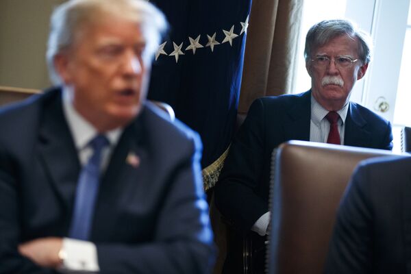 National security adviser John Bolton listens as President Donald Trump speaks during a cabinet meeting at the White House, Monday, April 9, 2018, in Washington National security adviser John Bolton listens as President Donald Trump speaks during a cabinet meeting at the White House, Monday, April 9, 2018, in Washington - Sputnik International