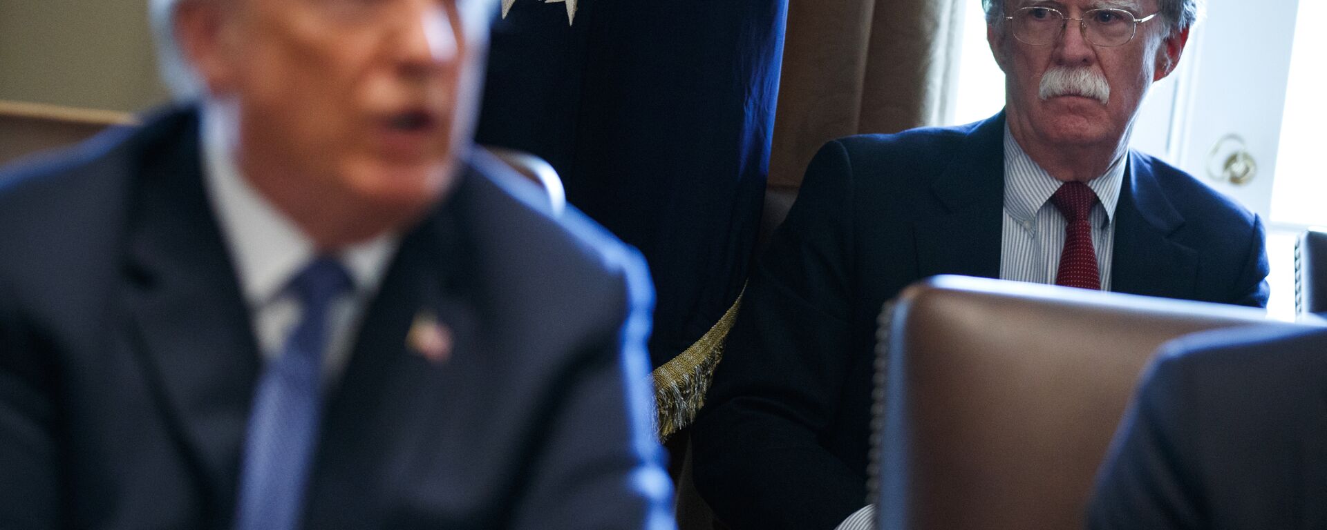 National security adviser John Bolton listens as President Donald Trump speaks during a cabinet meeting at the White House, Monday, April 9, 2018, in Washington - Sputnik International, 1920, 29.01.2020