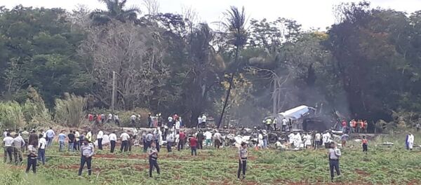Rescue and search workers on the site where a Cuban airliner with 104 passengers on board plummeted into a yuca field just after takeoff from the international airport in Havana, Cuba, Friday, May 18, 2018. Rescue and search workers on the site where a Cuban airliner with 104 passengers on board plummeted into a yuca field just after takeoff from the international airport in Havana, Cuba, Friday, May 18, 2018. - Sputnik International