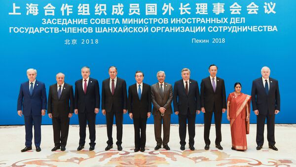 Foreign ministers and officials of the Shanghai Cooperation Organisation (SCO) pose for a group photo before a meeting at the Diaoyutai State Guest House in Beijing, China, April 24, 2018. - Sputnik International