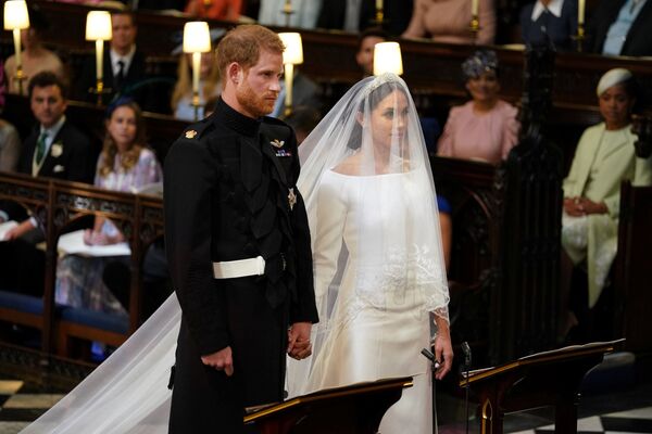 Prince Harry and Meghan Markle in St George's Chapel at Windsor Castle for their wedding in Windsor, Britain, May 19, 2018 Prince Harry and Meghan Markle in St George's Chapel at Windsor Castle for their wedding in Windsor, Britain, May 19, 2018 - Sputnik International