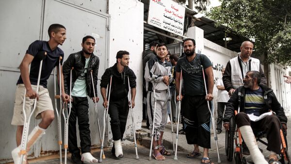 Palestinians, wounded in previous weeks during mass protests against Israeli forces along the border of the Palestinian enclave, dubbed The Great March of Return, await medical check-up at the Doctors Without Borders (MSF) clinic in Gaza City (File) - Sputnik International