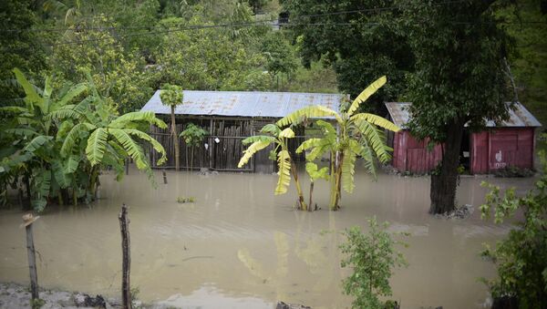 Flooded houses in the Melchor de Mencos municipality, Peten departament, in the border with Belize, 587 km northeast of Guatemala City, on August 4, 2016 - Sputnik International