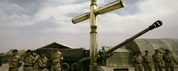 British army soldiers backdrop a cross, part of a monument in the memory of fallen comrades in Helmand province (File) British army soldiers backdrop a cross, part of a monument in the memory of fallen comrades in Helmand province (File) - Sputnik International