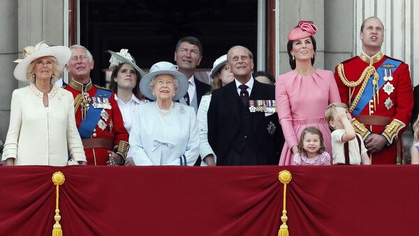 Members of Britain's Royal family from left, Camilla, the Duchess of Cornwall, Prince Charles, Princess Eugenie, Queen Elizabeth II, background Timothy Laurence, Princess Beatrice, Prince Philip, Kate, the Duchess of Cambridge, Princess Charlotte, Prince George and Prince William watch a fly past as they appear on the balcony of Buckingham Palace, after attending the annual Trooping the Colour Ceremony in London, Saturday, June 17, 2017 - Sputnik International
