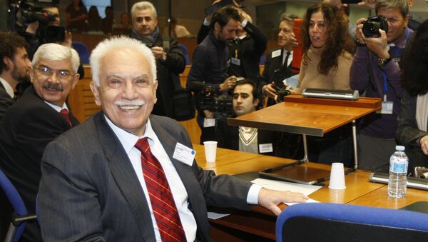 Turkish citizen, Dogu Perincek, poses for photographers prior to the start oh his hearing before the European Court of Human rights in Strasbourg, eastern France, Wednesday, Jan. 28, 2015 - Sputnik International