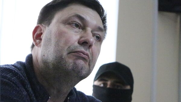 Kirill Vyshinskiy, bureau chief of RIA Novosti news agency in Ukraine, listens to lawyer in a court room in Kherson, Ukraine, Thursday, May 17, 2018 - Sputnik International