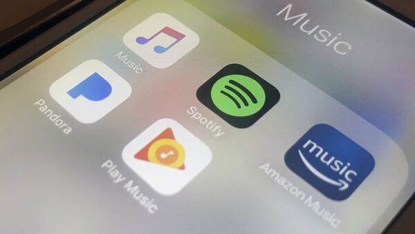 Music-streaming apps clockwise from top left, Apple, Spotify, Amazon, Pandora and Google on an iPhone. A federal copyright board in 2018 raised the music-streaming royalties for songwriters and music publishers by more than 40 percent after a dispute which had pitted songwriters against steadily growing music-streaming services. Picture taken 28 January 2018. - Sputnik International