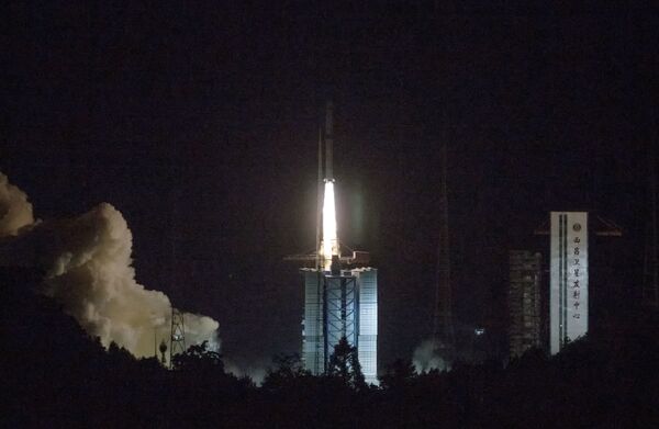 In this photo provided by China's official Xinhua News Agency, a Long March-4C rocket carrying a relay satellite, named Queqiao (Magpie Bridge), is launched from southwest China's Xichang Satellite Launch Center, Monday, May 21, 2018. China has launched a relay satellite as part of a groundbreaking program to land a probe on the far side of the moon this year. The China National Space Administration said on its website that the satellite lofted into space early Monday aboard a Long March-4C rocket will facilitate communication between controllers on Earth and the Chang'e 4 mission. In this photo provided by China's official Xinhua News Agency, a Long March-4C rocket carrying a relay satellite, named Queqiao (Magpie Bridge), is launched from southwest China's Xichang Satellite Launch Center, Monday, May 21, 2018. China has launched a relay satellite as part of a groundbreaking program to land a probe on the far side of the moon this year. The China National Space Administration said on its website that the satellite lofted into space early Monday aboard a Long March-4C rocket will facilitate communication between controllers on Earth and the Chang'e 4 mission. - Sputnik International