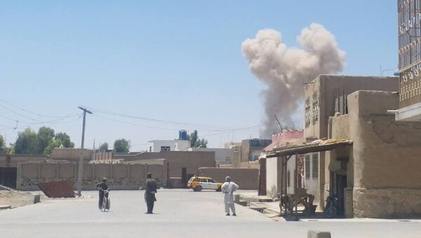 A cloud of smoke is seen after an explosion in Kandahar, Afghanistan May 22, 2018 in this picture obtained from social media - Sputnik International