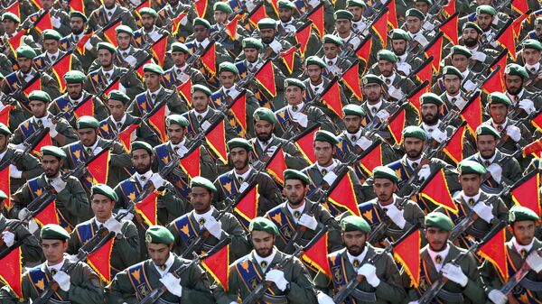 In this Sept. 21, 2016 file photo, Iran's Revolutionary Guard troops march in a military parade marking the 36th anniversary of Iraq's 1980 invasion of Iran, in front of the shrine of late revolutionary founder Ayatollah Khomeini, just outside Tehran, Iran - Sputnik International