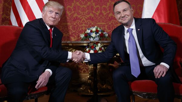 U.S. President Donald Trump, left, and Polish President Andrzej Duda pose for photographers as they shake hands during their meeting at the Royal Castle, Thursday, July 6, 2017, in Warsaw - Sputnik International