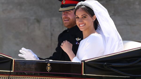 Meghan Markle and Prince Harry ride in an Ascot Landau carriage at Windsor Castle after their wedding in Windsor, Britain, May 19, 2018 - Sputnik International