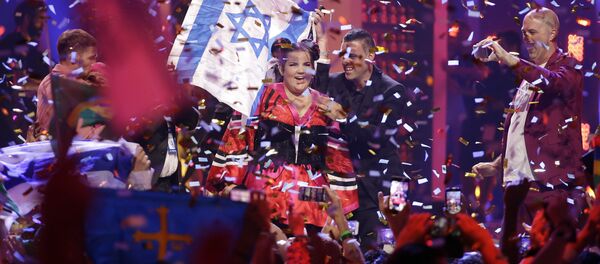 Netta from Israel celebrates after winning the Eurovision Song Contest grand final in Lisbon, Portugal, Saturday, May 12, 2018 - Sputnik International