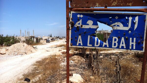 A picture taken on June 7, 2013, shows a heavily damaged sign signaling the entrance of Dabaa, north of Qusayr, in Syria's central Homs province. - Sputnik International