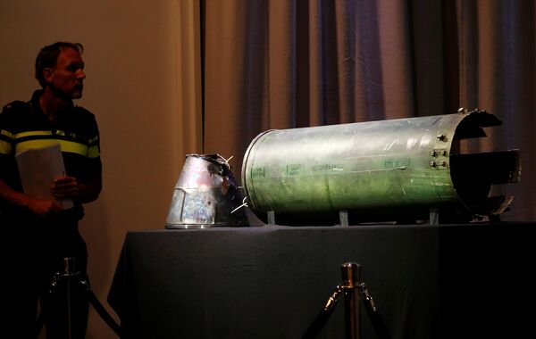 A damaged missile is displayed during a news conference by members of the Joint Investigation Team, comprising the authorities from Australia, Belgium, Malaysia, the Netherlands and Ukraine, who present interim results in the ongoing investigation of the 2014 MH17 crash that killed 298 people over eastern Ukraine, in Bunnik, Netherlands, May 24, 2018 A damaged missile is displayed during a news conference by members of the Joint Investigation Team, comprising the authorities from Australia, Belgium, Malaysia, the Netherlands and Ukraine, who present interim results in the ongoing investigation of the 2014 MH17 crash that killed 298 people over eastern Ukraine, in Bunnik, Netherlands, May 24, 2018 - Sputnik International