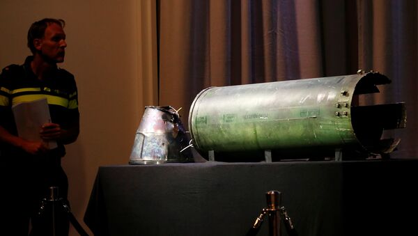 A damaged missile is displayed during a news conference by members of the Joint Investigation Team, comprising the authorities from Australia, Belgium, Malaysia, the Netherlands and Ukraine, who present interim results in the ongoing investigation of the 2014 MH17 crash that killed 298 people over eastern Ukraine, in Bunnik, Netherlands, May 24, 2018 - Sputnik International