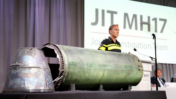 A damaged missile is displayed during a news conference by members of the Joint Investigation Team, comprising the authorities from Australia, Belgium, Malaysia, the Netherlands and Ukraine who present interim results in the ongoing investigation of the 2014 MH17 crash that killed 298 people over eastern Ukraine, in Bunnik, Netherlands, May 24, 2018 - Sputnik International