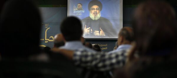 Hezbollah leader Sheik Hassan Nasrallah speaks on a screen via a video link during a ceremony to mark the second anniversary of the death of Hezbollah top commander, Mustafa Badreddine, who was killed in an explosion in Damascus, in the southern suburbs of Beirut, Lebanon, Monday, May 14, 2018 Hezbollah leader Sheik Hassan Nasrallah speaks on a screen via a video link during a ceremony to mark the second anniversary of the death of Hezbollah top commander, Mustafa Badreddine, who was killed in an explosion in Damascus, in the southern suburbs of Beirut, Lebanon, Monday, May 14, 2018 - Sputnik International