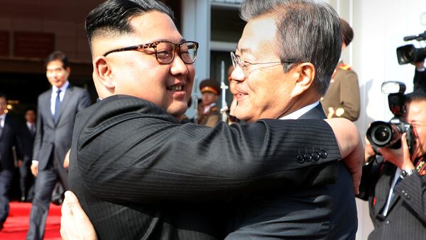 South Korean President Moon Jae-in bids fairwell to North Korean leader Kim Jong Un as he leaves after their summit at the truce village of Panmunjom, North Korea, in this handout picture provided by the Presidential Blue House on May 26, 2018 - Sputnik International
