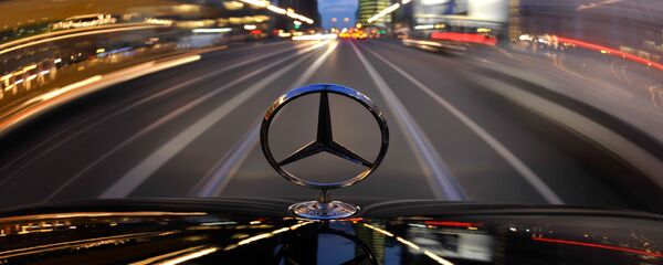 The star emblem on the hood of a driving Mercedes-Benz is seen near Potsdam Square, Potsdamer Platz, in Berlin The star emblem on the hood of a driving Mercedes-Benz is seen near Potsdam Square, Potsdamer Platz, in Berlin - Sputnik International